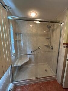 Consider the pros and cons of a walk-in shower conversion with a glass sliding door